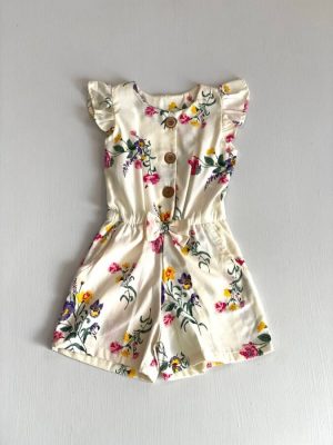 3332. Jumper beige de flores y moño al centro