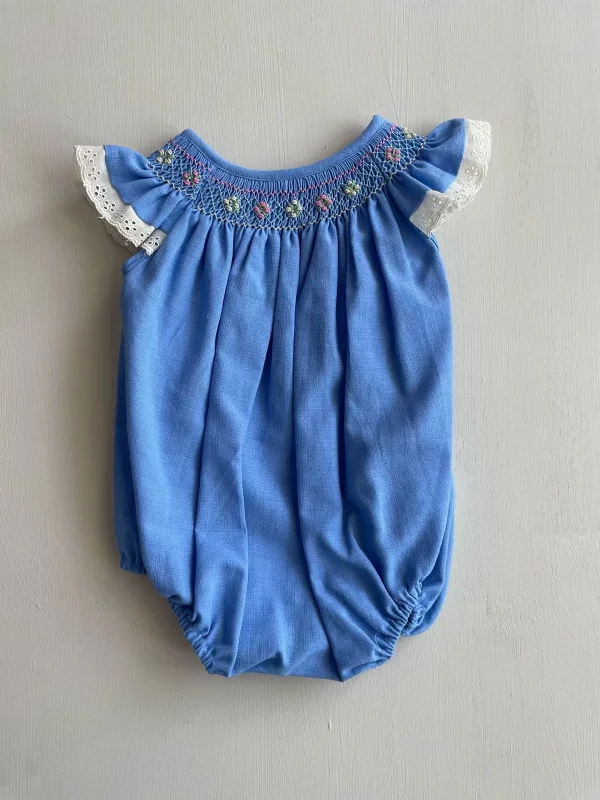 34127. Ranita azul con bordado smock